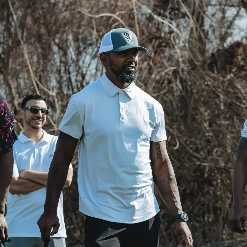 Charles Woodson playing golf on CGA