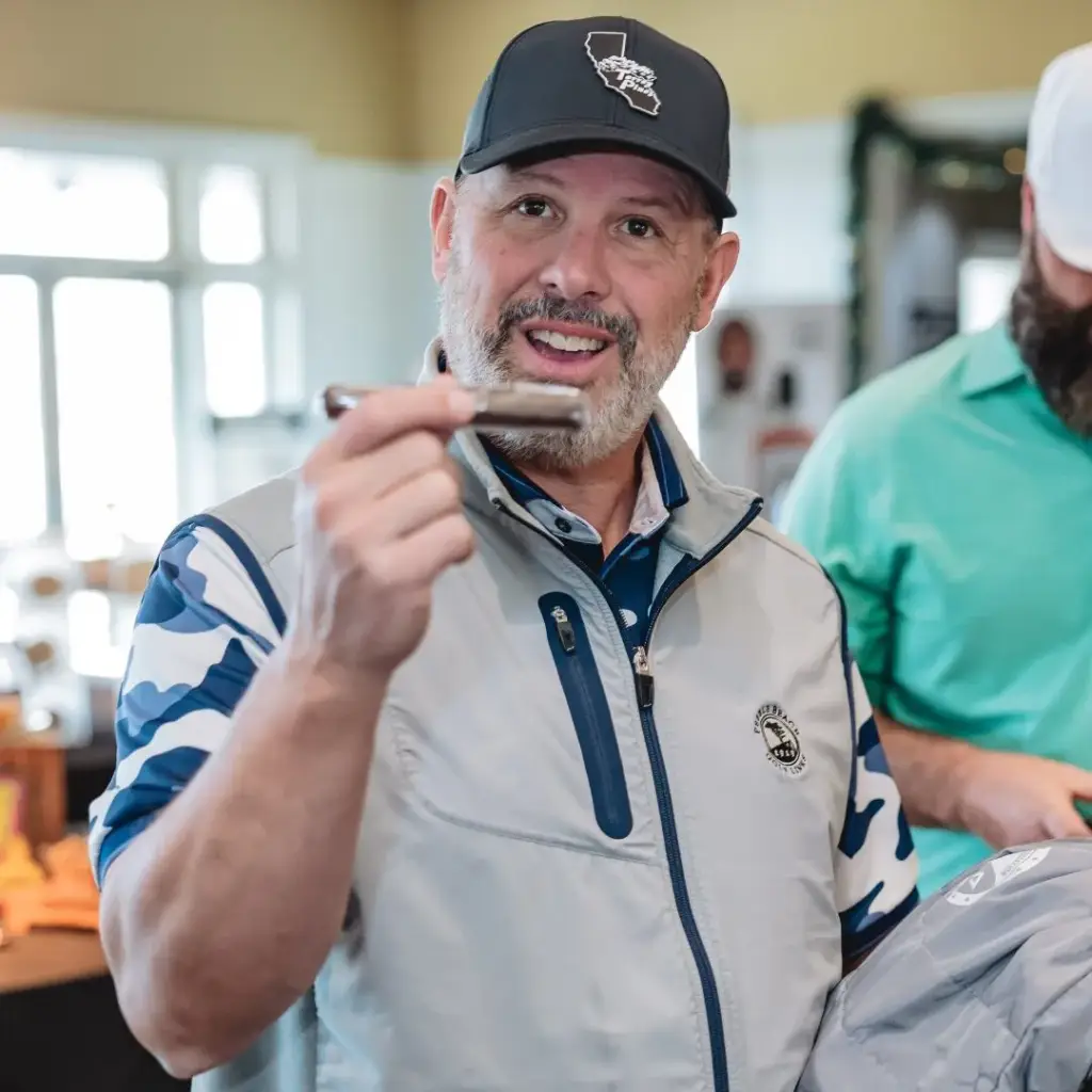Member lighting a cigar at the 19th hole lounge