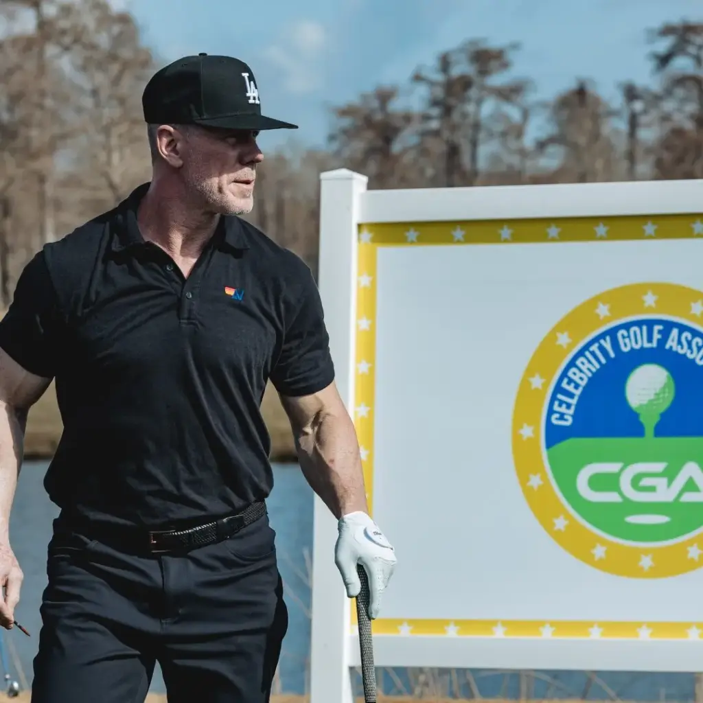 golfer beside cga signage