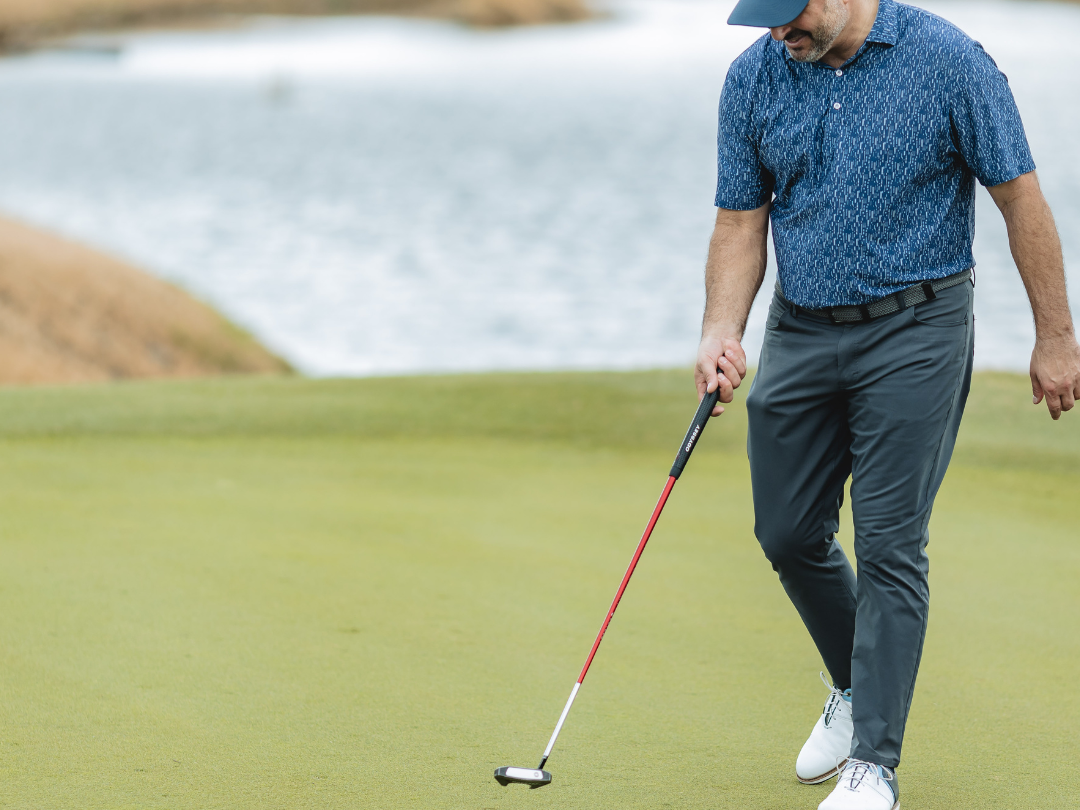 Golfer making a perfect chip onto the green