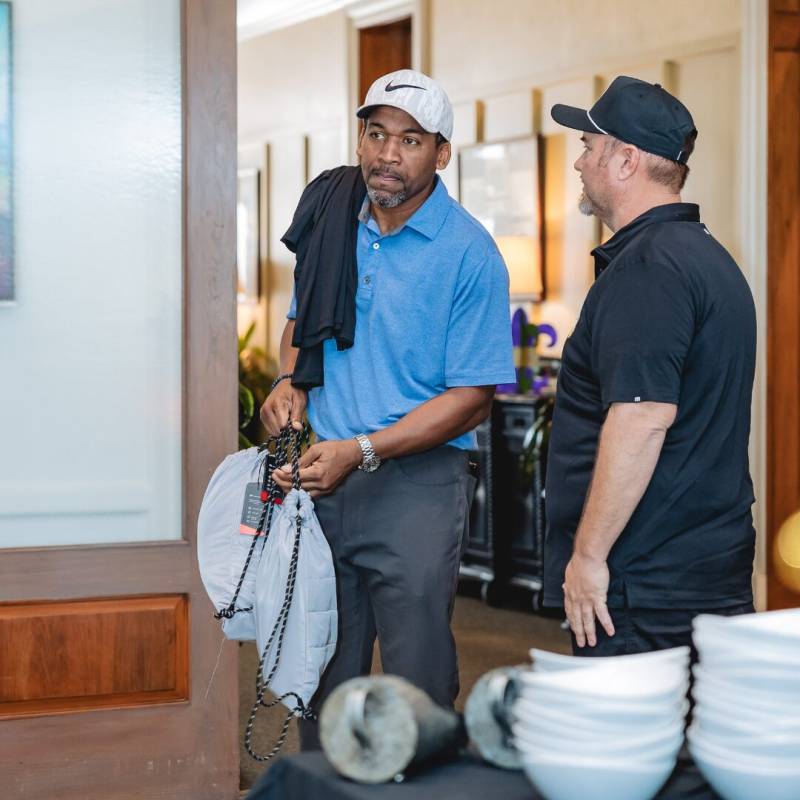 CGA Players receiving their golf loot bags from sponsors