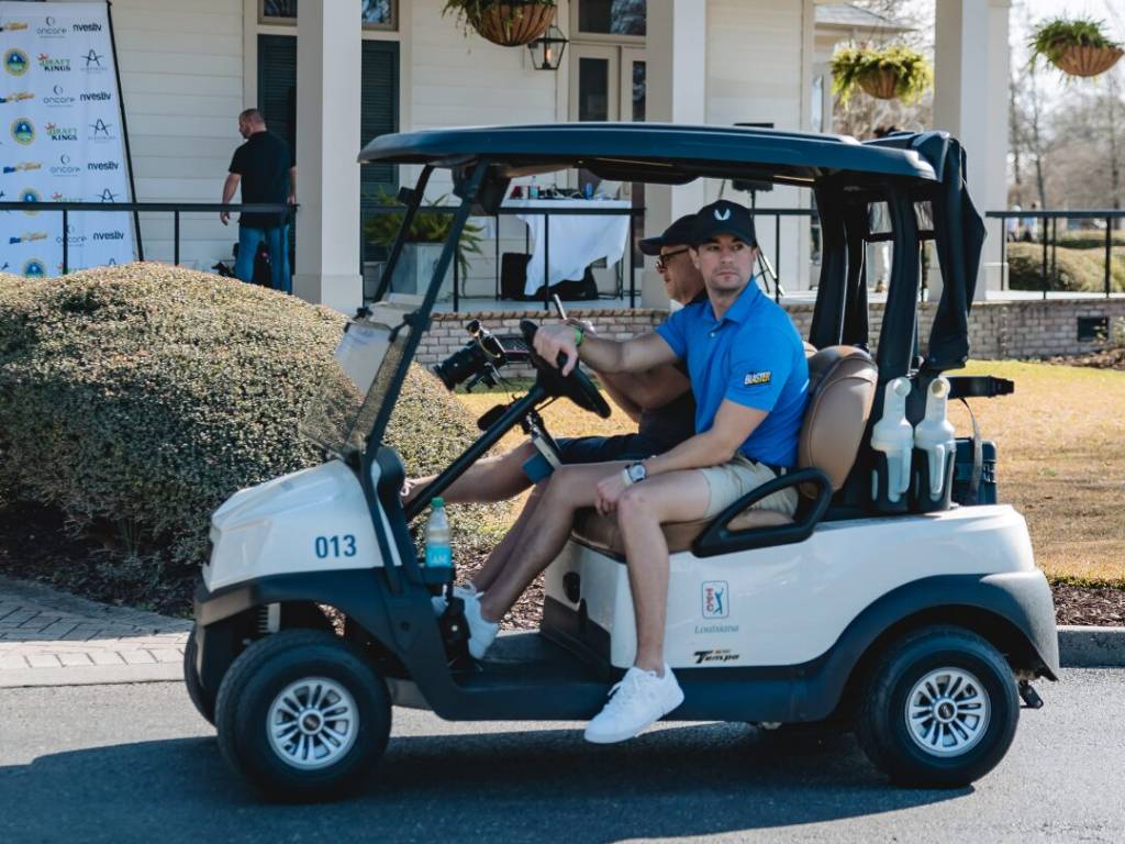 CGA Player driving their golf cart