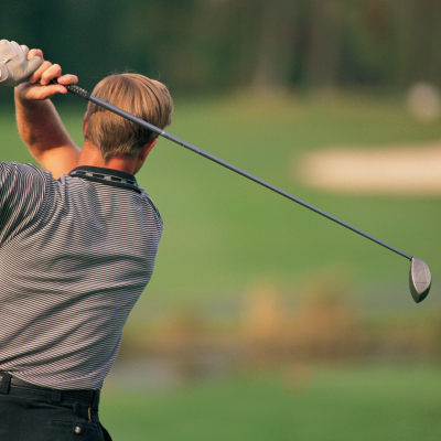 golfer taking a drive