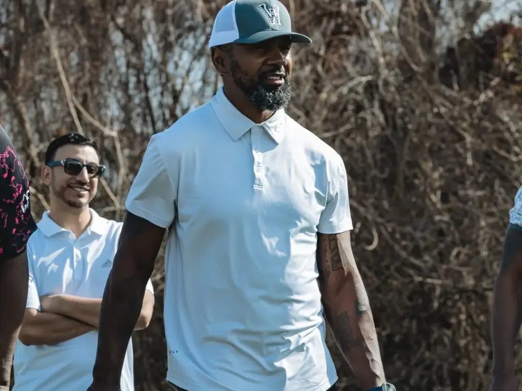 Charles Woodson playing golf on CGA