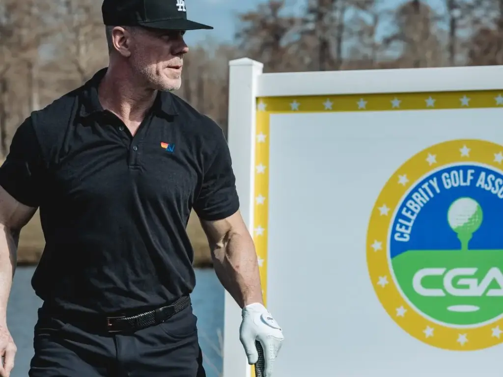 golfer beside cga signage